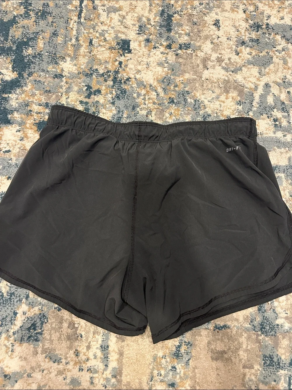 Nike Women's Black Athletic Shorts with Teal Swoosh